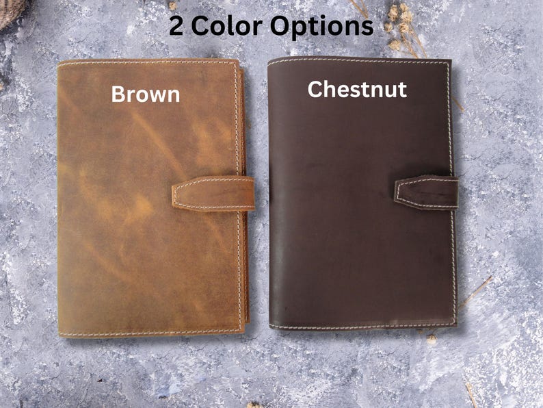 May include: Two leather-bound journals, one brown and one chestnut, with the words "Brown" and "Chestnut" printed on the front covers.  2 Color Options.
