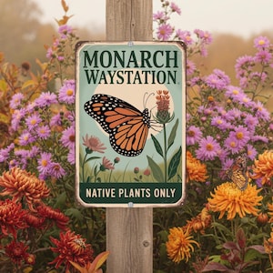 May include: A rectangular metal sign with the words "MONARCH WAYSTATION" and "NATIVE PLANTS ONLY". The sign features a monarch butterfly illustration in orange, black, and white, with a light green background. The sign is mounted on a wooden post, surrounded by colorful flowers.