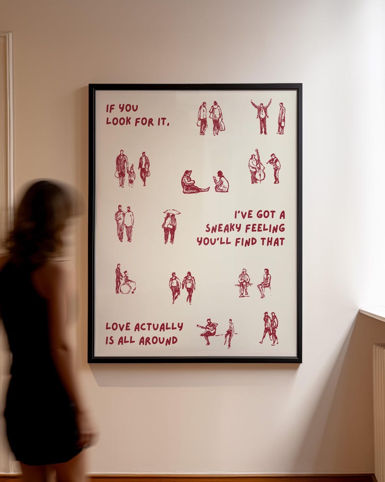 Puede incluir: Impresi&oacute;n art&iacute;stica enmarcada con borde negro. La impresi&oacute;n presenta ilustraciones rojas de personas en varias poses, con el texto "IF YOU LOOK FOR IT", "I'VE GOT A SNEAKY FEELING YOU'LL FIND THAT" y "LOVE ACTUALLY IS ALL AROUND."