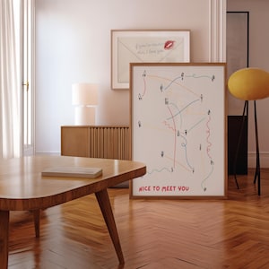 May include: A framed print with the words "NICE TO MEET YOU" displays a network of connecting lines and stick figures in multiple colours. Above, another framed print shows an envelope with the text "if you're reading this, I love you."