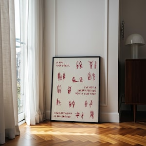 Puede incluir: L&aacute;mina art&iacute;stica enmarcada con borde negro. La impresi&oacute;n presenta ilustraciones rojas de personas y el texto "IF YOU LOOK FOR IT", "I'VE GOT A SNEAKY FEELING YOU'LL FIND THAT" y "LOVE ACTUALLY IS ALL AROUND."