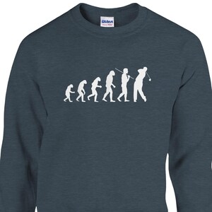 May include: A dark blue sweatshirt featuring a white graphic depicting the evolution of man, ending with a golfer swinging a club.