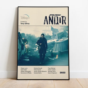 May include: A vintage-style poster for the Star Wars series Andor, featuring a man walking through a destroyed cityscape. The poster includes the title "STAR WARS ANDOR" and the year "2022".