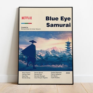 May include: A poster for the Netflix series "Blue Eye Samurai" featuring a man in a black robe walking through a Japanese village. The poster has a blue, pink, and orange color scheme and the text "NETFLIX" in red and white.