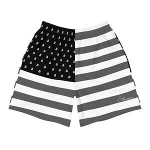 May include: Black and white patterned swim trunks with a Bitcoin symbol on one side and an American flag design on the other side. The text "Crypto Beachwear.com" is on the right leg.