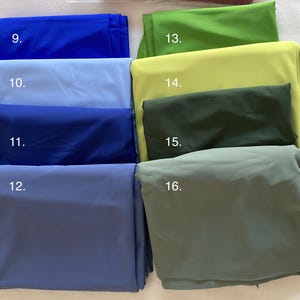 May include: A collection of eight folded fabric swatches arranged in two columns. The left column features shades of blue labeled 9 through 12, while the right column displays shades of green labeled 13 through 16, ranging from bright lime to muted olive.