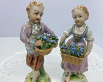 Pair of Dresden Saxon Porcelain Girl and Boy Figurines With Flowers