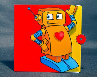 Puede incluir: Una tarjeta roja y amarilla con un robot de dibujos animados con un corazón en el pecho. El robot tiene brazos azules y una antena azul. La tarjeta tiene un pequeño engranaje con un corazón en el centro.