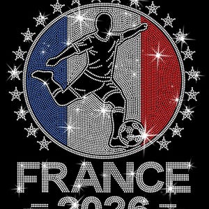 May include: “France 2026” soccer design. The artwork includes a soccer player silhouette layered over a French flag inspired background with sparkling star accents surrounding the circular design. Royal blue, red, and silver rhinestones are used throughout the graphic.