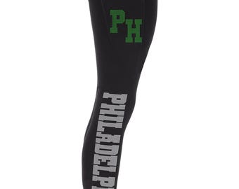 May include: Black leggings with a white "PHILADELPHIA" print on the side and a green "PH" logo on the back pocket.