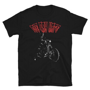 May include: Black t-shirt with a red graphic of a motorcycle and the text "We Only Hate" in red.
