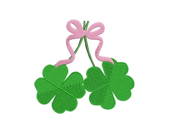 May include: Two green four-leaf clovers tied together with a pink ribbon bow.