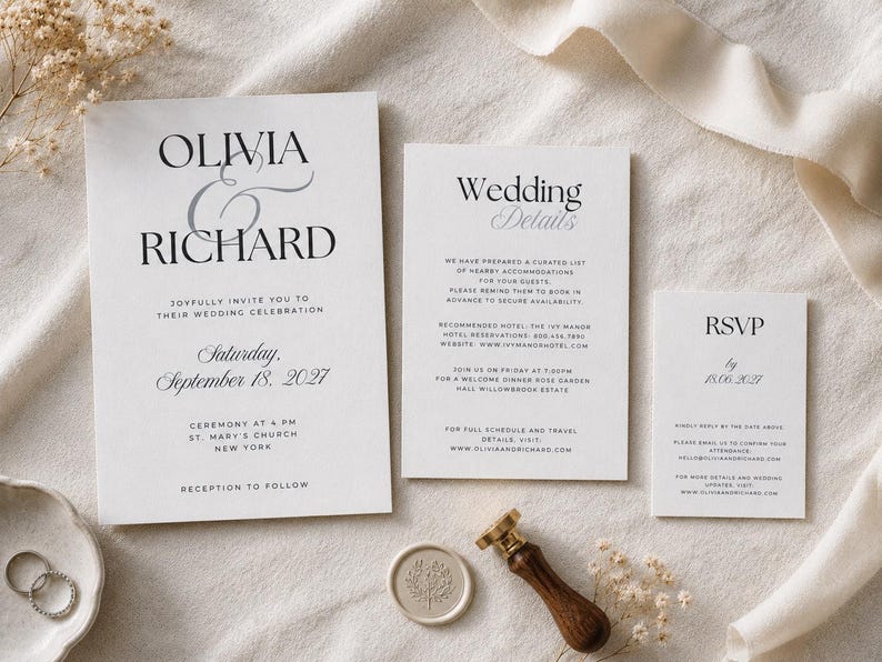 May include: A white wedding invitation suite featuring black serif typography with the names Olivia and Richard, a separate details card, and an RSVP card. A wax seal with a botanical design and a wooden handle stamp are placed next to the cards.