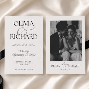May include: A white wedding invitation set featuring black serif typography. The left card displays the names Olivia & Richard, date September 18, 2027, and ceremony details. The right card features a black and white photograph of a couple.
