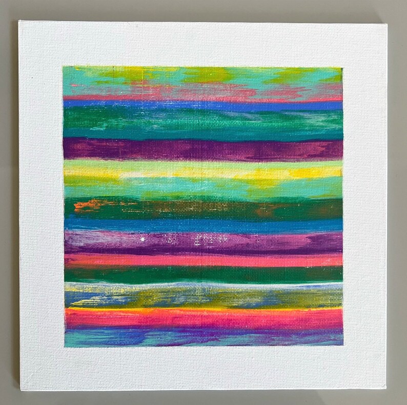 May include: Abstract painting with horizontal stripes in various colors, including green, blue, purple, yellow, and pink.