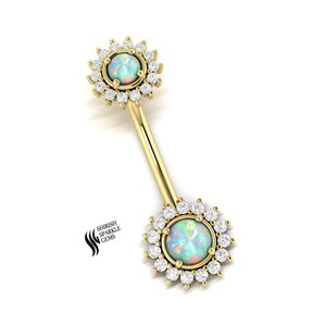 May include: Gold body jewelry with two opal gemstones surrounded by a halo of clear cubic zirconia stones.