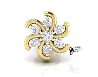 May include: A gold nose ring with a flower design featuring six clear diamonds. The ring is set with a larger diamond in the center and five smaller diamonds around it.