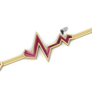 Könnte beinhalten: Goldfarbener Barbell mit einem rosafarbenen Herzen an jedem Ende und einem rosafarbenen und goldenen Herzschlag-Design in der Mitte.