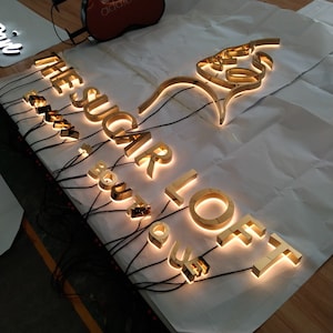 acrylic office signage, storefront led sign, illuminated letters, marquee business sign, custom metal business sign, custom outdoor signage