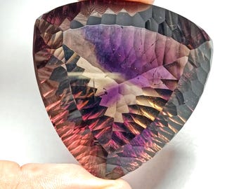 World&#39;s Biggest Natural AMETRIN/ SUPER SEVEN 486.95Cts Trillion Shaped Cut Cabochon with Rutile Inside suitable for making Jewelry.