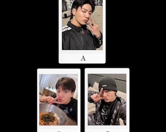 May include: Three polaroid-style photos on a black background. The photos feature a person in various poses. The person is wearing a black jacket in one photo, a black beanie in another, and a black shirt in the third. The person is making a peace sign in two of the photos.