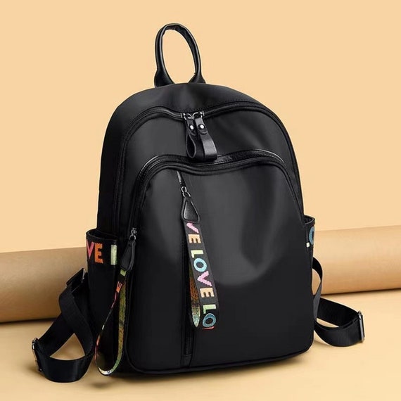 multi pocket backpack purse