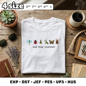 May include: White t-shirt featuring embroidered insects and the phrase "sad bug summer". The design includes a dragonfly, ladybug, bee, praying mantis, butterfly, and beetle. Available in sizes 15 cm, 18 cm, 20 cm, and 23 cm.