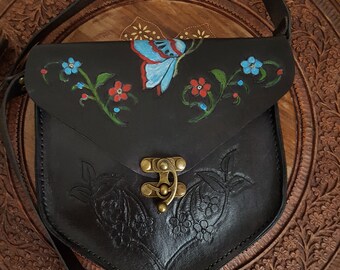 Black ladies shoulder bag made of real natural leather. It is hand-painted with leather carving technique.