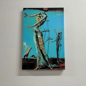 May include: A surrealist painting featuring two figures with elongated limbs. The figures are standing on a blue background with a giraffe and a mountain in the distance. The painting is done in a style reminiscent of Salvador Dali.