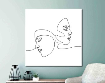 May include: A black and white line drawing of two faces, one looking to the right and the other looking to the left, on a white background.
