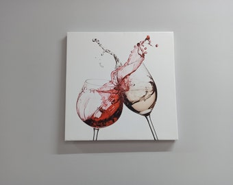 May include: A white canvas print featuring a close-up of two wine glasses with red and white wine splashing out of them.