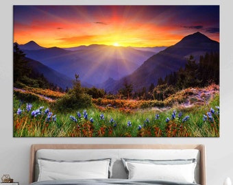 May include: A vibrant sunset over a mountain range with a field of purple wildflowers in the foreground.
