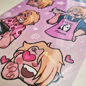 May include: A set of four stickers featuring a cartoon character with blonde hair. The character is shown in different poses, including holding a plate of food, laughing, and giving a thumbs up. The stickers are printed on a pink background with hearts and swirls.