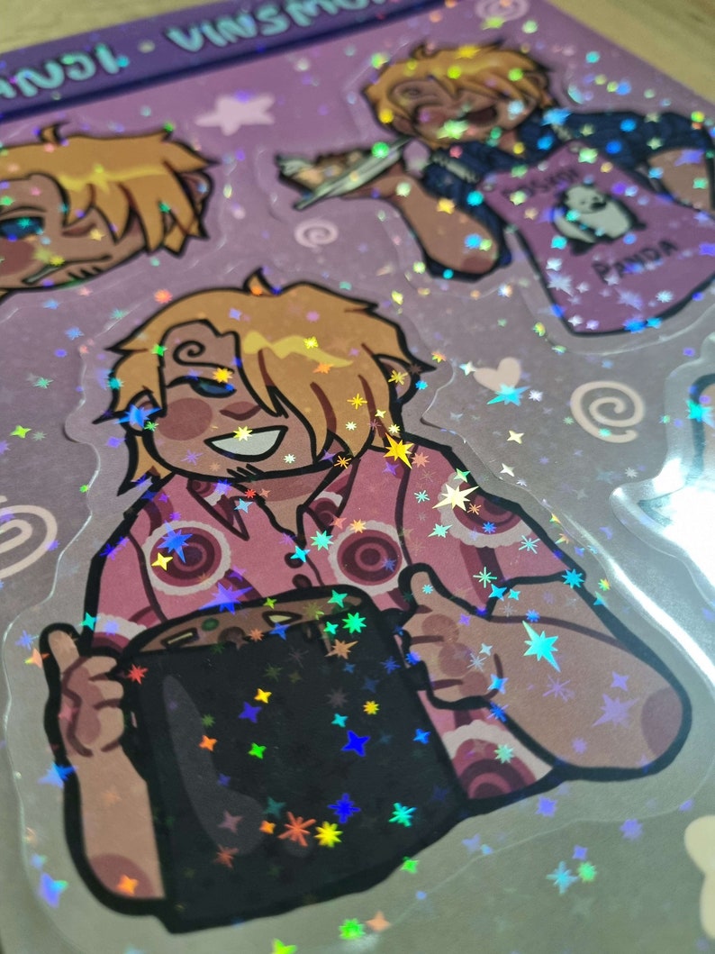 May include: A holographic sticker featuring a cartoon character with blonde hair holding a black mug. The character is wearing a pink and white shirt with a star pattern. The background is a purple and white holographic pattern with stars.