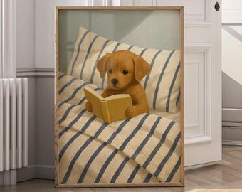 May include: Framed artwork featuring a golden retriever puppy reading a book in bed. The puppy is nestled in a bed with blue and white striped bedding and a matching pillow. The artwork is in a wooden frame.