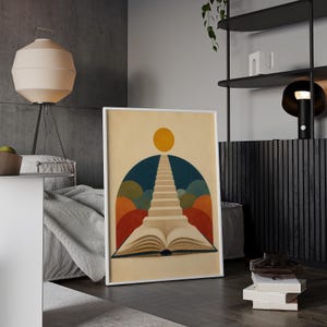 K&ouml;nnte beinhalten: Ein gerahmter, rechteckiger Wandkunstdruck, der ein aufgeschlagenes Buch zeigt, dessen Seiten eine Treppe bilden, die zu einer gelben Sonne f&uuml;hrt. Der Hintergrund besteht aus einem dunkelblauen Bogen und halbkreisf&ouml;rmigen Formen in Gr&uuml;n, Orange und Rot.