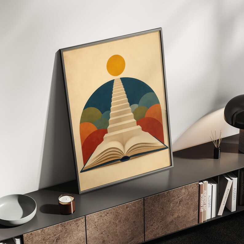 K&ouml;nnte beinhalten: Ein gerahmter, rechteckiger Kunstdruck mit einem aufgeschlagenen Buch, dessen Seiten eine Treppe in Richtung einer gelben Sonne bilden. Der Hintergrund zeigt einen dunkelblauen Bogen, umgeben von &uuml;berlappenden Halbkreisen in Orange, Gr&uuml;n und Rot.