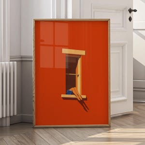 May include: A framed art print featuring a minimalist illustration. The artwork depicts a person relaxing in a window, with legs extending out. The background is a vibrant orange, and the frame is a natural wood tone.