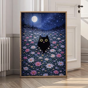 May include: A framed art print featuring a black cat with yellow eyes in a field of colorful flowers under a starry night sky with a full moon. The artwork has a whimsical and dreamy aesthetic, with a wooden frame.