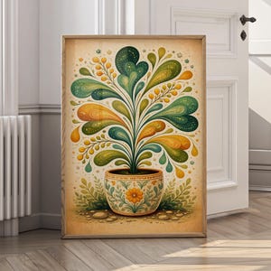 May include: A framed art print featuring a stylized plant in a decorative pot. The plant has green, yellow, and orange teardrop-shaped leaves and small yellow berry-like details. The pot is beige with a floral design, and the background is a light beige.