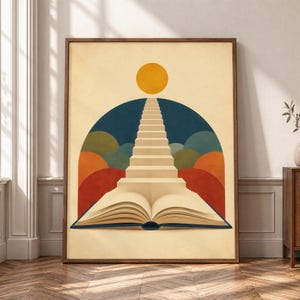 May include: A framed wall art print featuring an open book at the base with a staircase rising from the pages toward a yellow sun. The background includes a dark blue archway layered with semi-circular shapes in orange, green, and blue tones.
