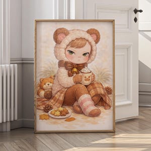 May include: A framed art print featuring a child in a bear-themed outfit, holding a mug of hot chocolate. The artwork has a warm color palette with brown, beige, and pink tones. A teddy bear and plate of cookies are also visible.