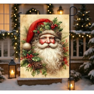 May include: A garden flag featuring a detailed illustration of Santa Claus. He wears a red hat and is surrounded by holly, berries, and pinecones. The flag has a vintage, slightly aged appearance, perfect for Christmas decor.