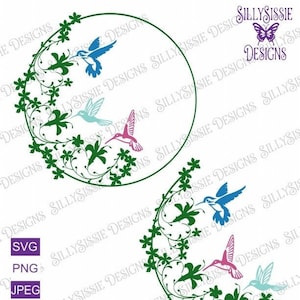 May include: Two circular floral wreaths with hummingbirds. The wreaths are green with white flowers and vines. The hummingbirds are blue, teal, and pink.