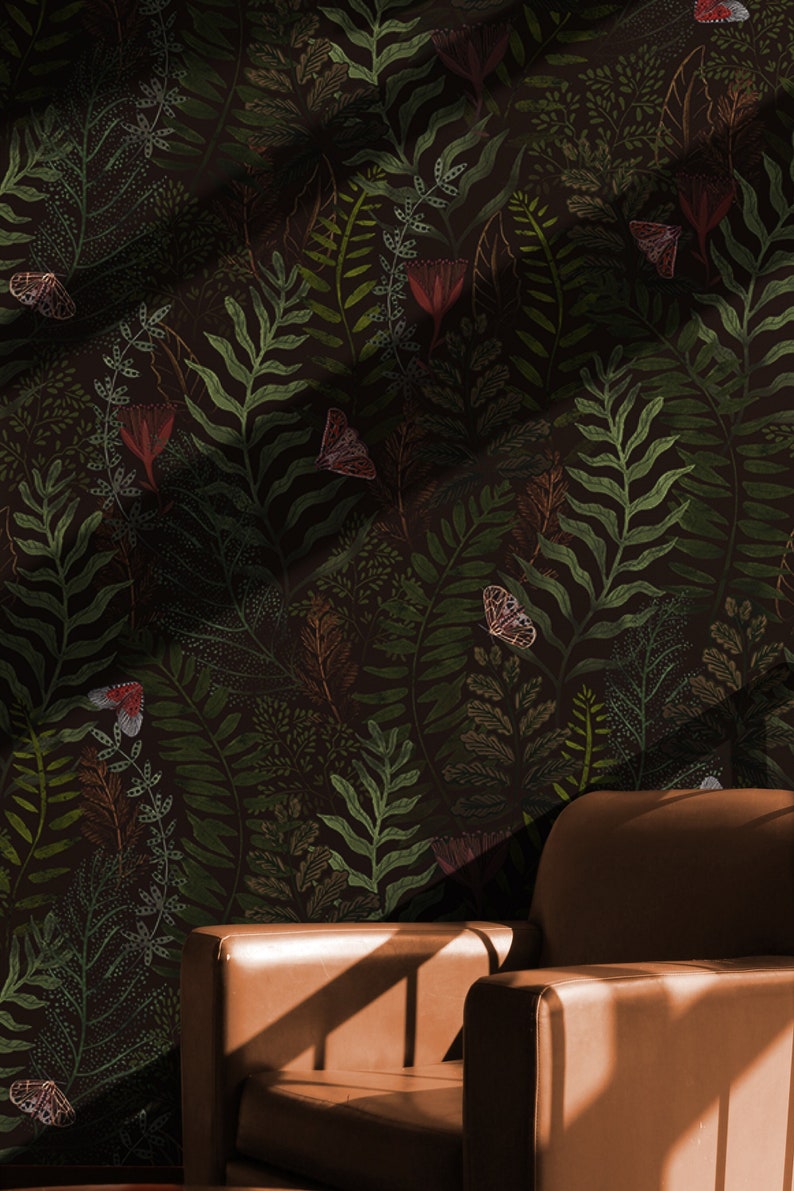 May include: A brown leather armchair with a dark green floral wallpaper featuring butterflies and leaves. The wallpaper has a subtle textured pattern.