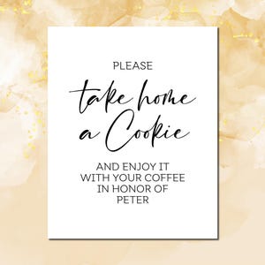 May include: White sign with black text that reads "PLEASE take home a Cookie AND ENJOY IT WITH YOUR COFFEE IN HONOR OF PETER".