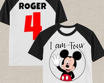 May include: A white and black baseball t-shirt with a red number 4 on the back and the name "ROGER" printed above it. The front of the shirt features a cartoon image of Mickey Mouse with the text "I am Four".
