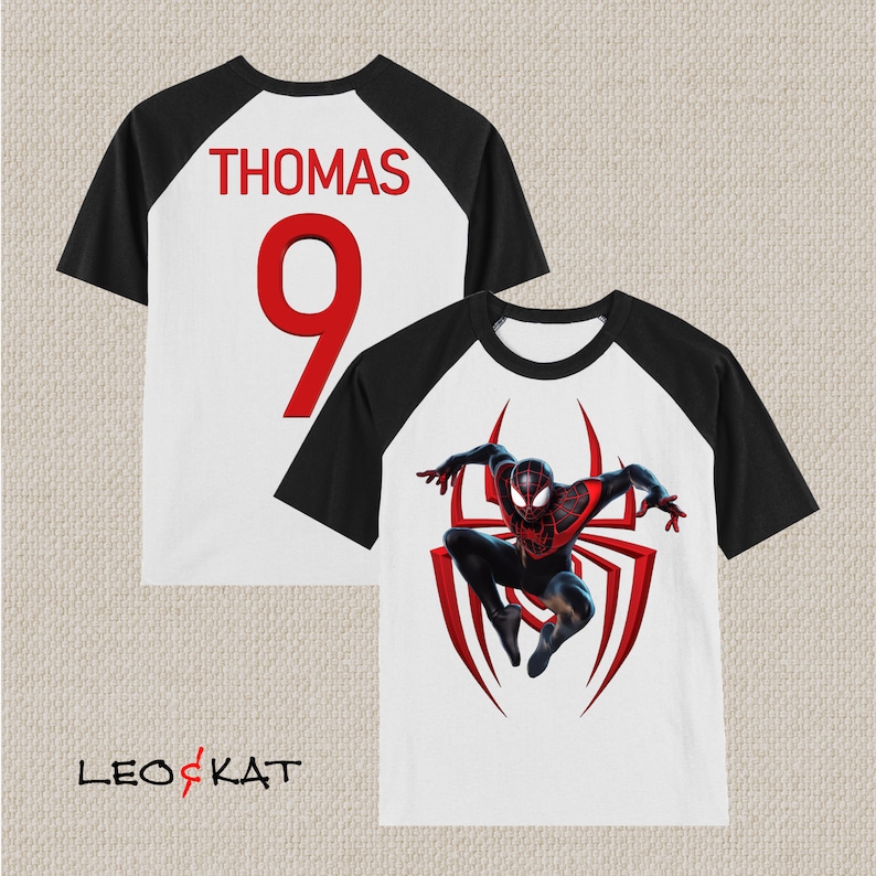 May include: White and black baseball t-shirt with a red spider-man graphic and the name "THOMAS" and the number "9" on the back.