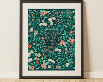 May include: Framed art print with a dark teal background and floral design. The print features the text "I can make deals with the devil because my dick's bigger" in a decorative font, surrounded by flowers.