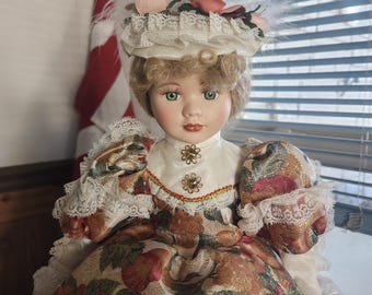 Beautiful  Porcelain doll  with wooden stand